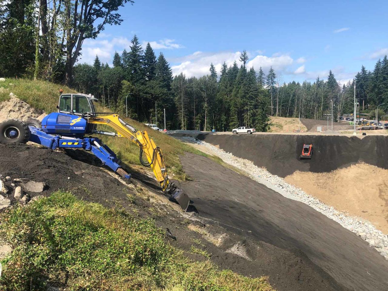 Mountain Highway Topsoil Placement Over The Edge Excavating